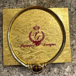 Premiere Designs Necklace Gold Tone Choker
length: 16 1/4 in. width: 1/4 in.